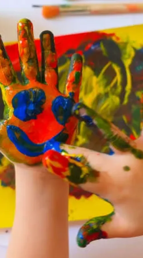 Child painting by finger hand . Ideas for drawing with finger paints. Children development . The concept of a happy childhood and children's day.